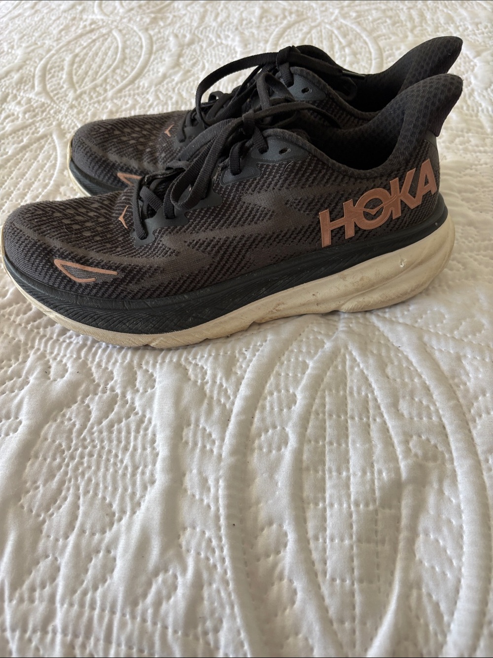 Hoka Clifton 9 Athletic Shoes in Black with Rose Gold Accents